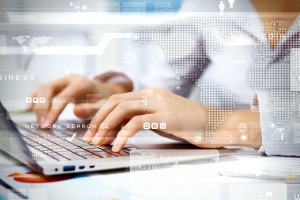person typing on their computer