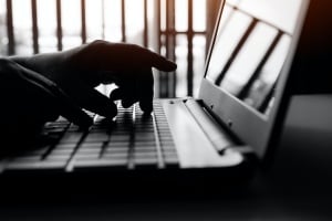 employee on his computer checking emails 
