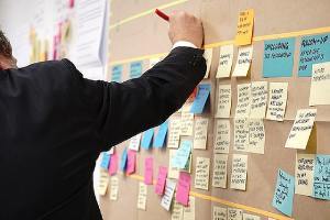 A bank executive implementing new strategies. M&A advisors can help a business implement new strategies