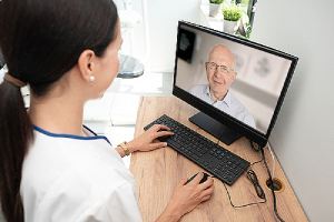 A doctor providing consultation to a patient. A Telehealth for Patients concept image