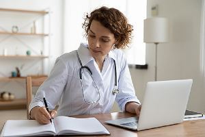 A female doctor providing medical consultation using a Telehealth Software