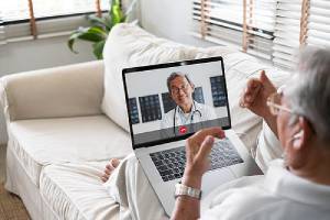 A patient and a doctor. One of the Pros of Telehealth improve patients’ access to quality healthcare services