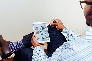 A professional reviewing financial data. Financial institutions can benefit from cyber risk advisory