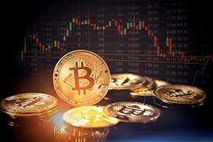 Bitcoin in front of digital charts