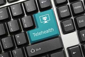 Close-up view on conceptual keyboard that has Telehealth consulting key