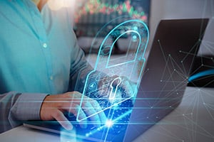 Cybersecurity concept person typing on laptop