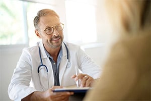 Doctor speaking with patient