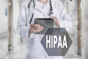 HIPAA Consulting- a doctor holding a tablet