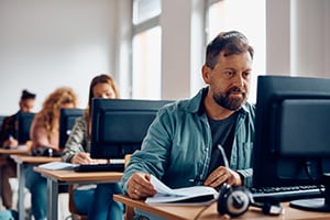 People sitting at computers and working