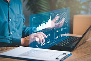 Person typing on laptop banking concept