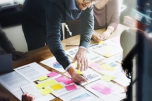 a business owner mapping out IT processes and improving IT infrastructure