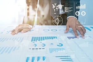 a businessman looking at charts and graphs 