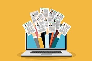 a computer with new applicates holding onto resumes coming out of the screen