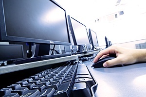 a row of computers in an office that has careers in it