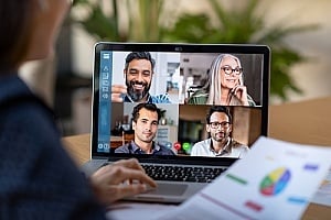 a team communicating online to develop an IT strategy