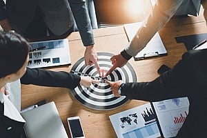 a team of professionals defining their business goals through a virtual event technology strategy