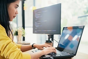 a women working on a computer with an erp software