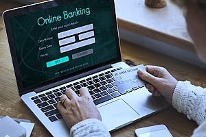 an individual using an online banking service as a result of innovation