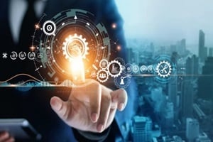 businessman touching brain in cogwheel