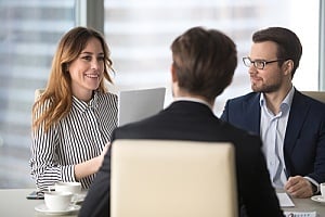 change management being discussed among business partners during a meeting