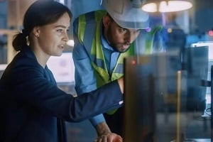 construction engineers checking files in computer system