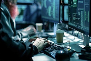 cybersecurity professional at his desk