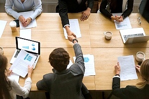 employees at a business meeting to discuss vendor selection
