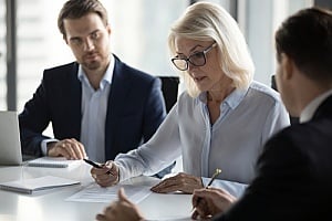 employees discussing managed service provider relationships