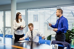 employees in a change management meeting discussing key audiences