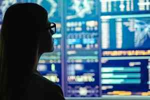 female data scientist reviewing data metrics
