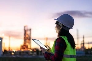 female engineer in construction site with ipad