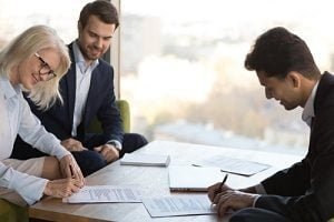 group of employees conducting IT due diligence