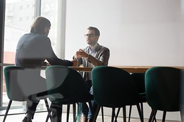 technology consultants speaking over strategy with a new client
