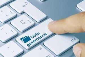 man pressing data governance key on keyboard