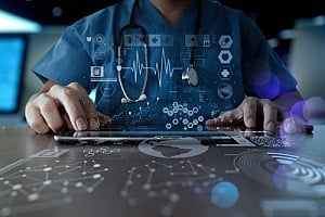 medical doctor working on a tablet 