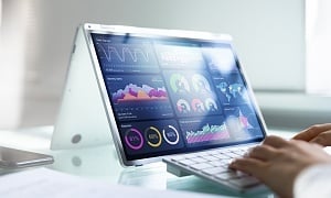 medical employee working on a tablet looking at analytics