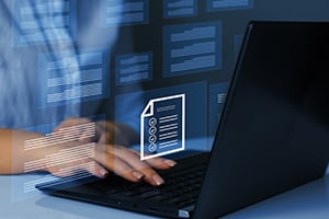 Person typing on laptop