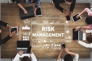 risk management concept on wooden table
