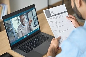 senior living manager conducting interview virtually