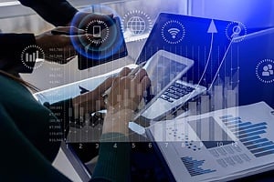 two banking employees working on tablets