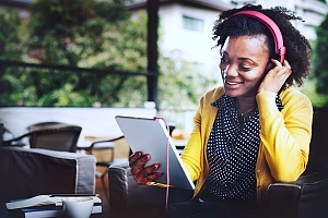 woman listening to helpful podcasts on her device
