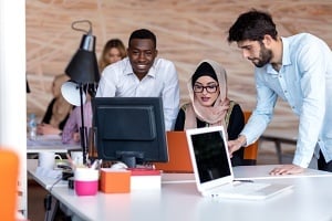 young college students using laptops to organize and present ideas