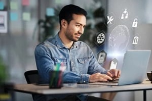 youngman studying on laptop